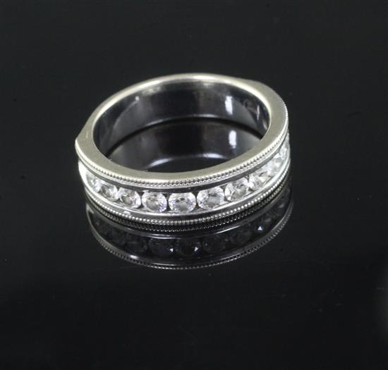 A modern 18ct white gold and twelve stone diamond half eternity ring, size Q/R.